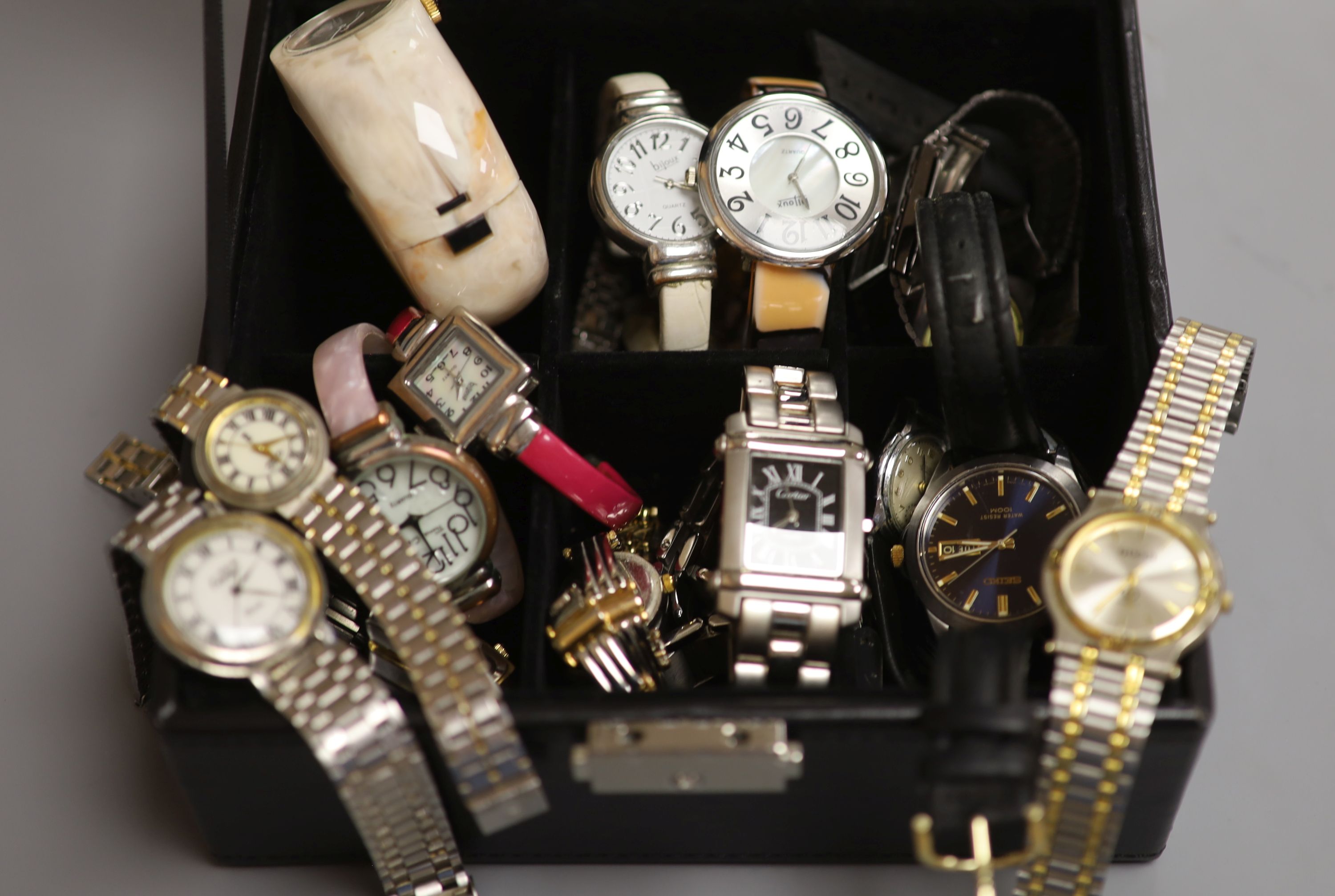 A collection of lady's and gentlemen's quartz and other wristwatches including Seiko.